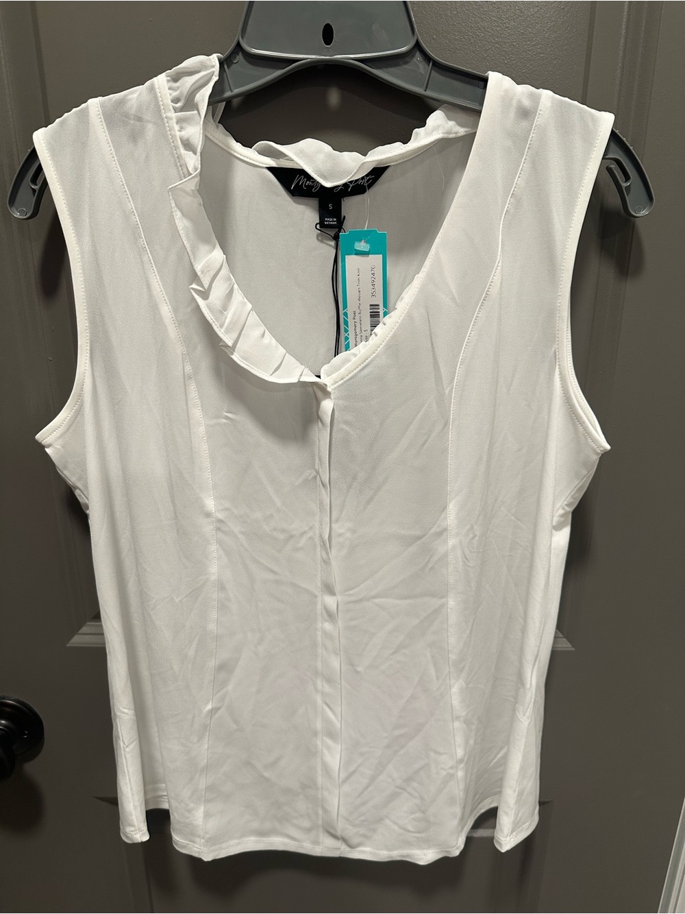 MONTGOMERY POST
Elenna Sleeveless Ruffle Woven
Trim Knit